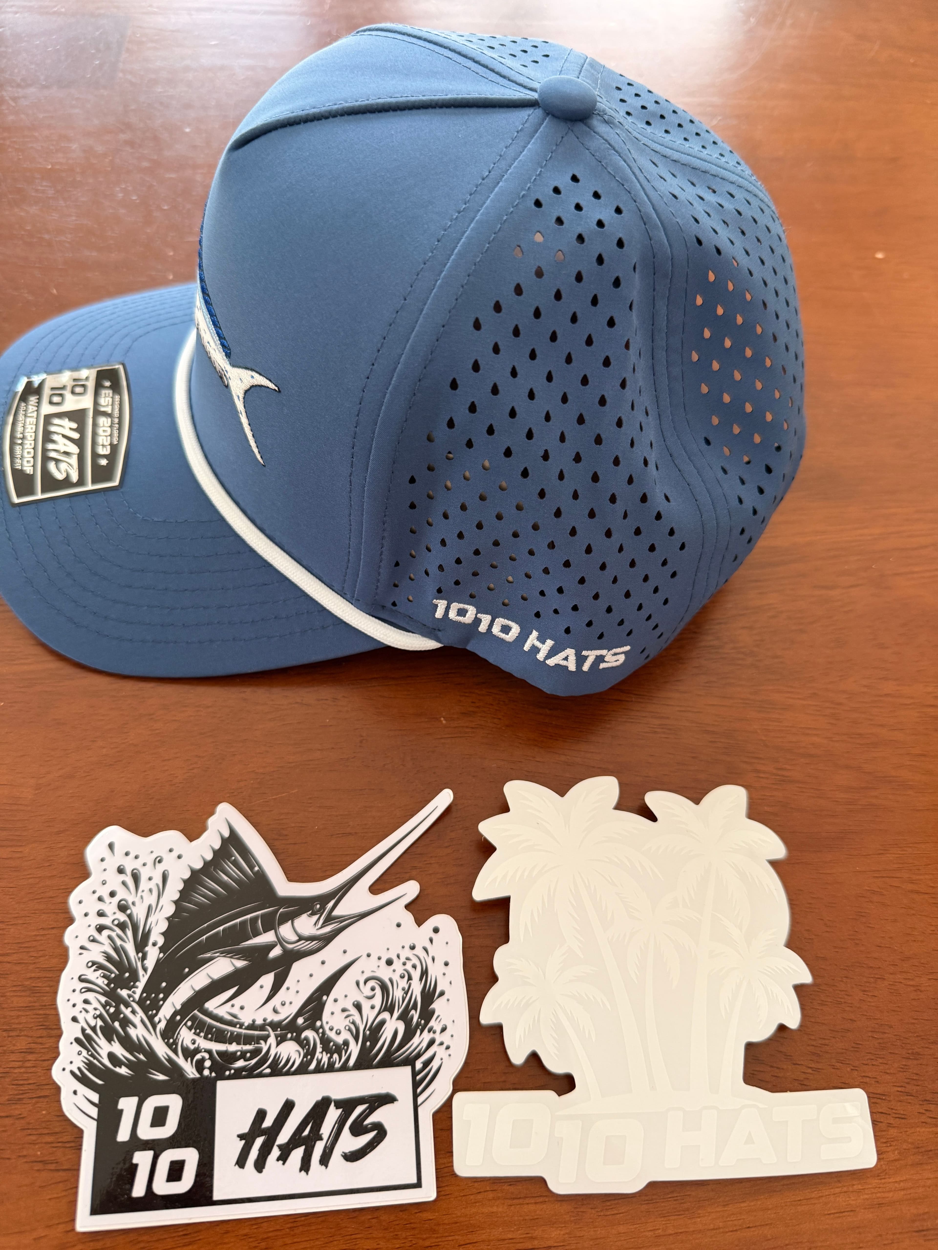Side view of the 10-10 Hats Mahi Fish Hat showing the laser-perforated side panel and embroidered "1010 Hats" wordmark