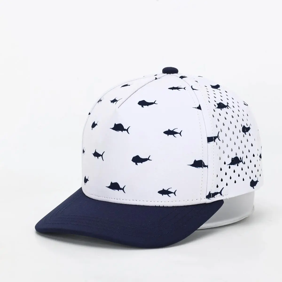 10-10 Hats Navy 5-panel kids cap, front three-quarter view, with an all-over navy fish-silhouette print and a solid navy brim