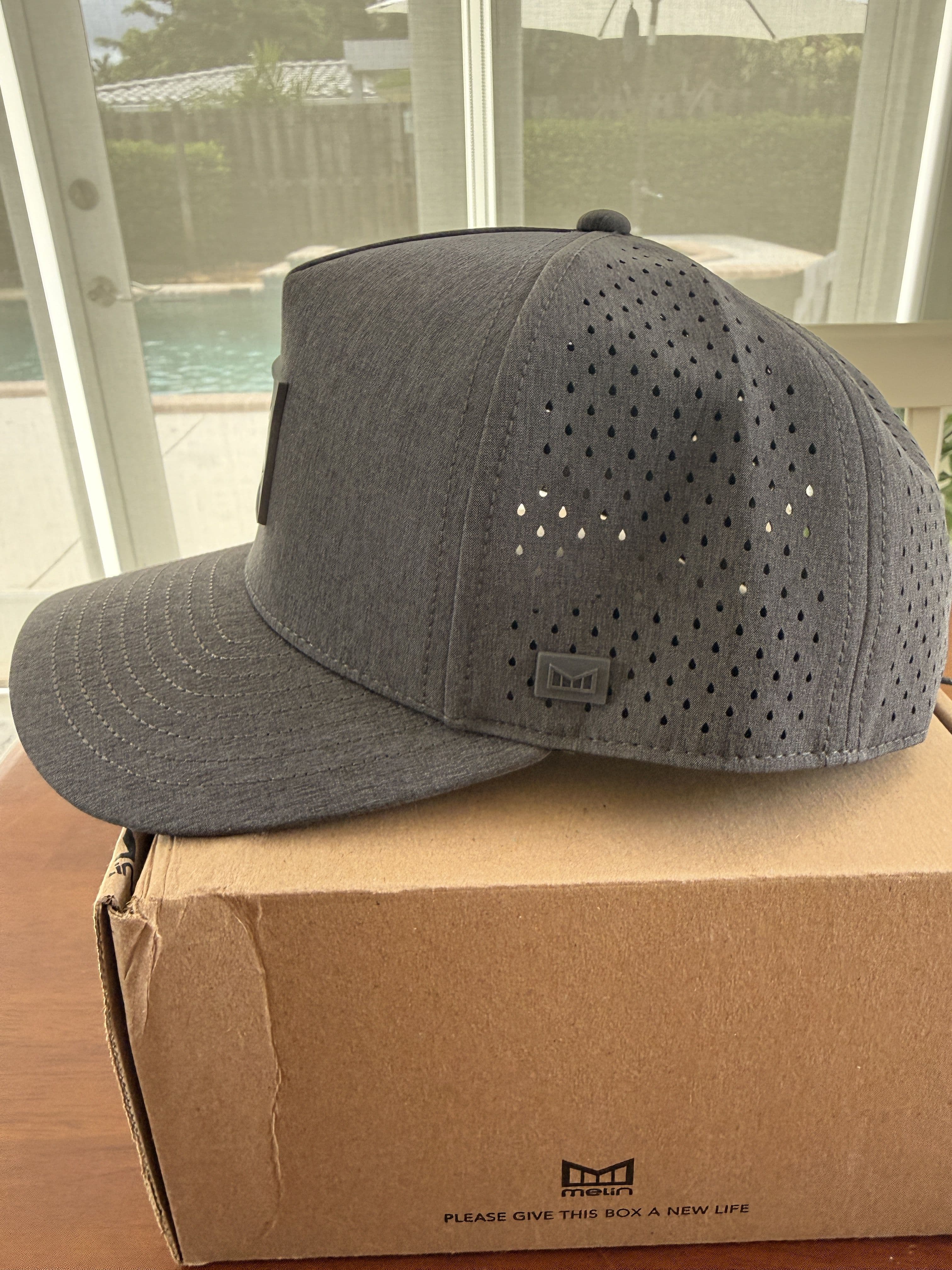 Side profile of the Odysea Stacked HYDRO showing its laser-perforated side panel